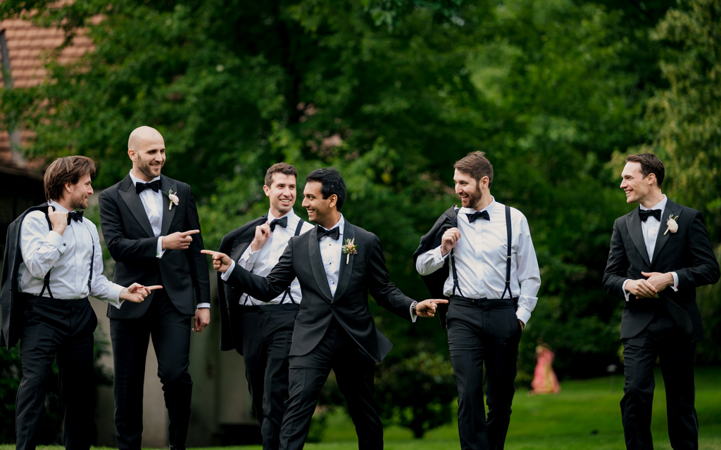 Groom and groomsmen pose for a fun and classic portrait at Pleasantdale Chateau.